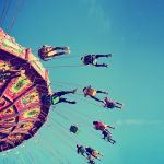 A,Swinging,Fair,Ride,At,Dusk,Toned,With,A,Retro